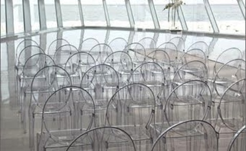 lucite chairs set up for an art event