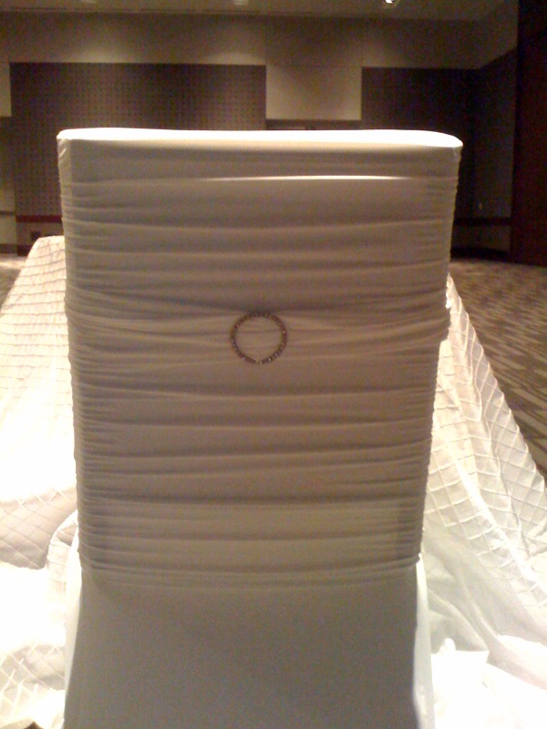 diamond sashes on white ruched chair covers for weddings
