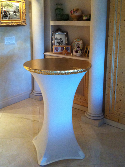 gold spandex table topper over white spandex