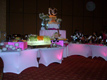 white spandex buffet tables with pink LED lighting