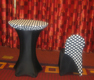 white polka dotted table topper over black spandex